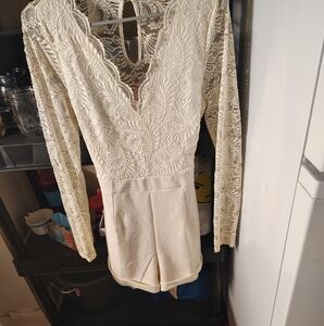Cream colored size large romper shorts outfit . Brand is IRIS. Worn one time....